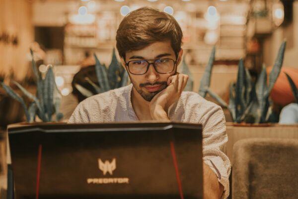 Confused small business owner in front of laptop